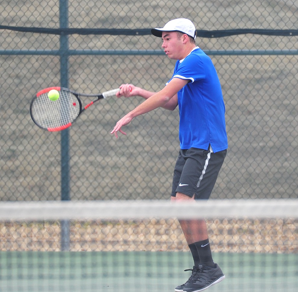 Prescott's Sam Stoecker hits a return shot as the Badgers take on the Mingus Union Marauders in tennis Wednesday in Prescott. (Les Stukenberg/Courier)