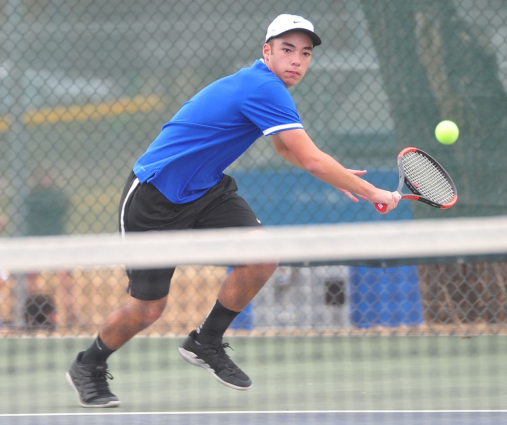 Prescott's Sam Stoecker hits a return shot as the Badgers take on the Mingus Union Marauders in tennis Wednesday in Prescott. (Les Stukenberg/Courier)