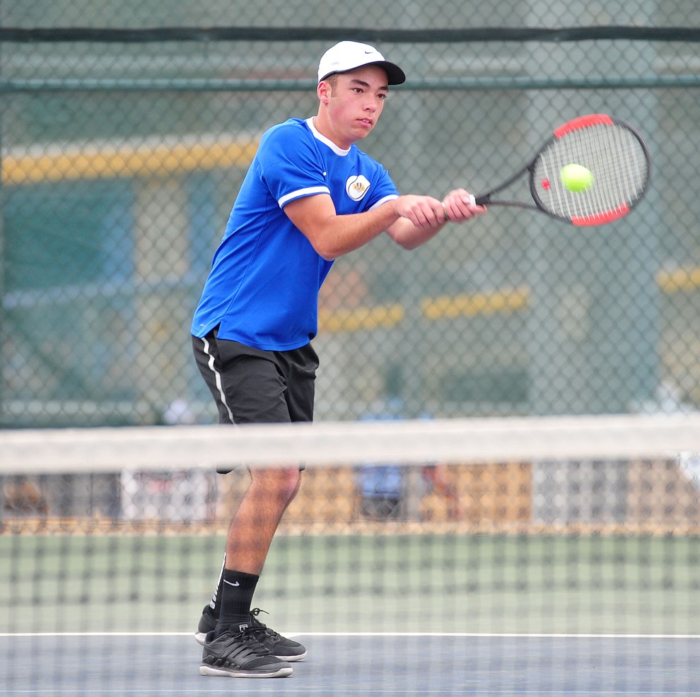 Prescott's Sam Stoecker hits a return shot as the Badgers take on the Mingus Union Marauders in tennis Wednesday in Prescott. (Les Stukenberg/Courier)