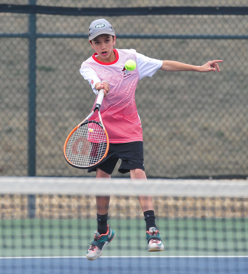 Mingus' John Valentine hits a return shot as the Marauders take on the Prescott Badgers in tennis Wednesday in Prescott. (Les Stukenberg/Courier)
