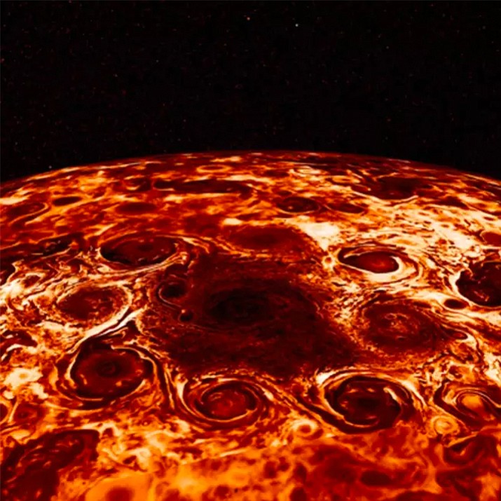This composite image provided by NASA, derived from data collected by the Jupiter-orbiting Juno spacecraft, shows the central cyclone at the planet's north pole and the eight cyclones that encircle it. Jupiter’s poles are blanketed by geometric clusters of cyclones and its atmosphere is deeper than suspected, scientists reported Wednesday, March 7, 2018. (NASA/JPL-Caltech/SwRI/ASI/INAF/JIRAM via AP)

