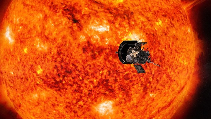 This illustration from NASA shows Parker Solar Probe spacecraft approaching the sun. NASA is accepting online submissions until April 27, 2018, for sending your name on the spacecraft all the way to the sun. (NASA/Johns Hopkins APL/Steve Gribben via AP)

