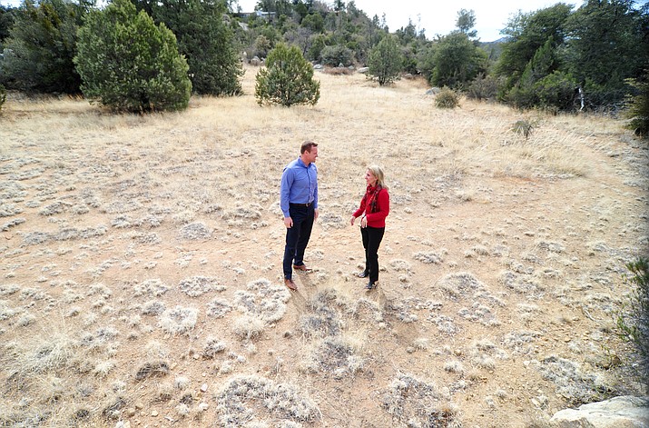 Granite Mountain School Principal Teresa Bruso and Yavapai County Schools Administrator Stan Goligoski walk a piece of land that could possibly be used for new teacher housing next to the school in Prescott. (Les Stukenberg/Courier)