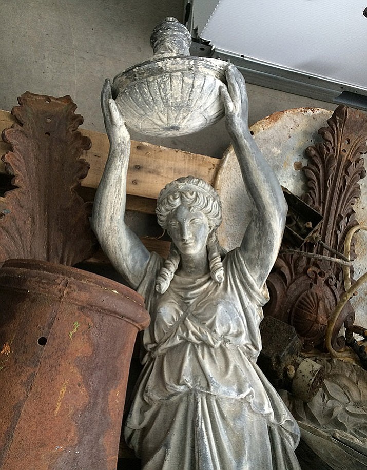Lady Ermintrude lies among the rusty damaged artifacts of her fountain centerpiece. She may yet be resurrected in bronze and returned to her home on the courthouse plaza. (Courier file photo)