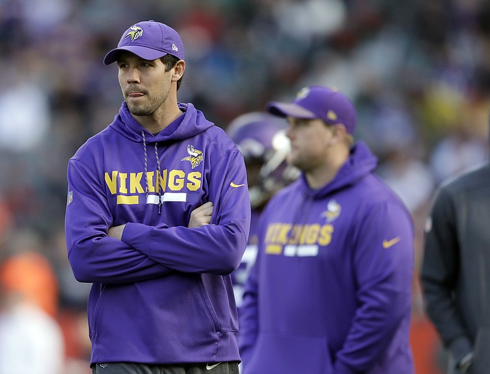 In this Oct. 29, 2017, file photo, Minnesota Vikings quarterback Sam Bradford stands on the field before game against Cleveland Browns at Twickenham Stadium in London. Bradford has reportedly agreed to a deal with the Arizona Cardinals. (Matt Dunham/AP, File)