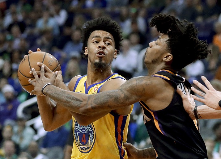 Golden State Warriors guard Quinn Cook looks to shoot past Phoenix Suns guard Elfrid Payton during the first half Saturday, March 17, 2018, in Phoenix. (Chris Carlson/AP)