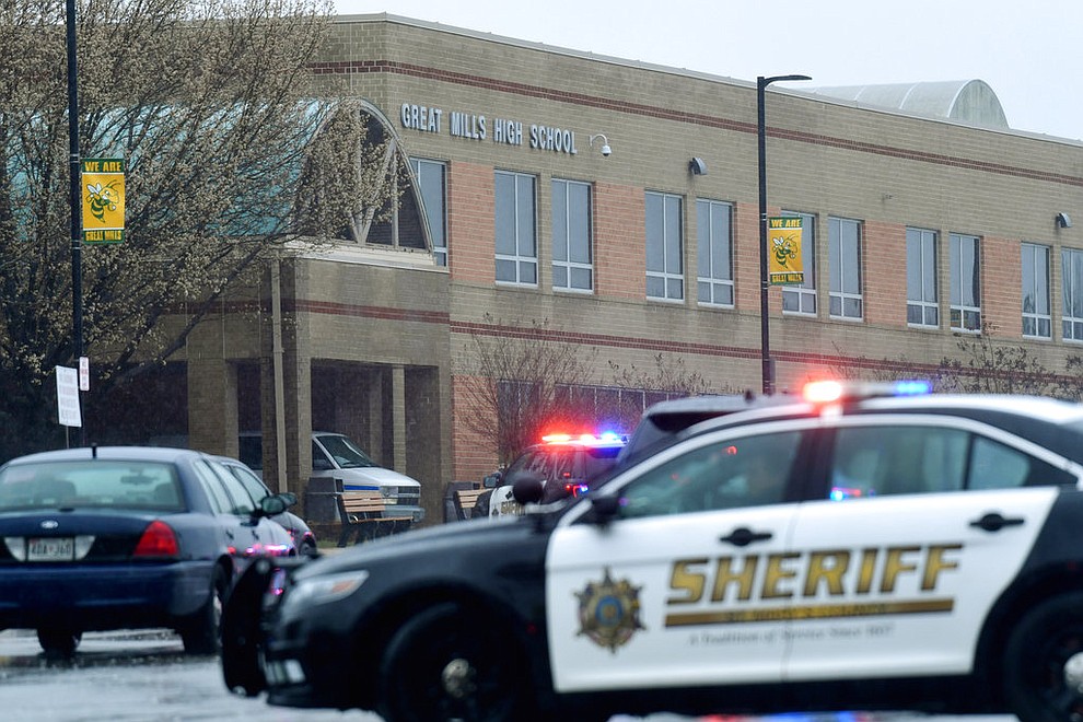 Deputies, federal agents and rescue personnel, converge on Great Mills High School, the scene of a shooting, Tuesday morning, March 20, 2018 in Great Mills, Md.  (AP Photo/Susan Walsh)