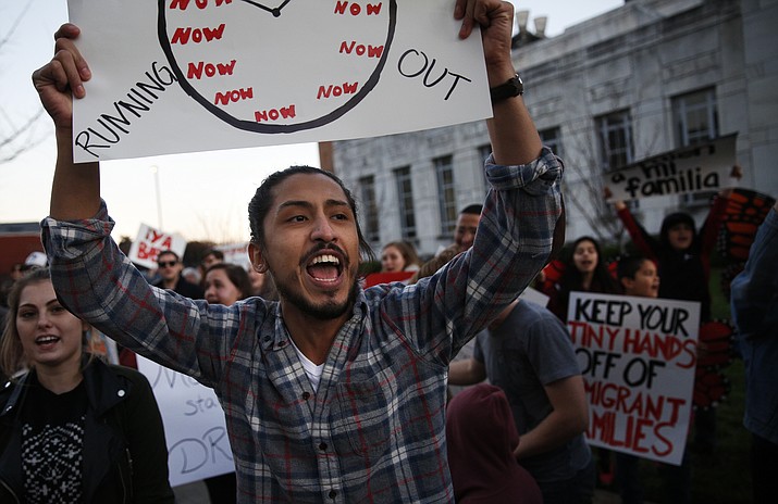 Elias Garcia chants with other demonstrators on Martin Luther King Boulevard during a United We Dream march in Chattanooga, Tenn., Saturday, March 3, 2018. (Doug Strickland/Chattanooga Times Free Press, via AP)