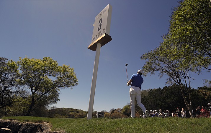 Jordan Spieth watches his shot from the third tee during a practice round at the Dell Technologies Match Play golf tournament at the Austin Country Club on Tuesday, March 20, 2018, in Austin, Texas. (Eric Gay/AP)