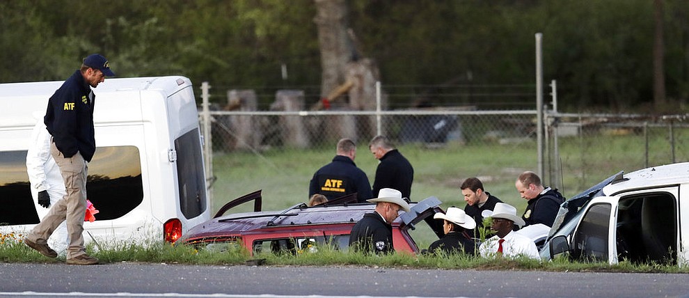 Officials investigate the scene where a suspect in a series of bombing attacks in Austin blew himself up as authorities closed in, Wednesday, March 21, 2018, in Round Rock, Texas. (AP Photo/Eric Gay)