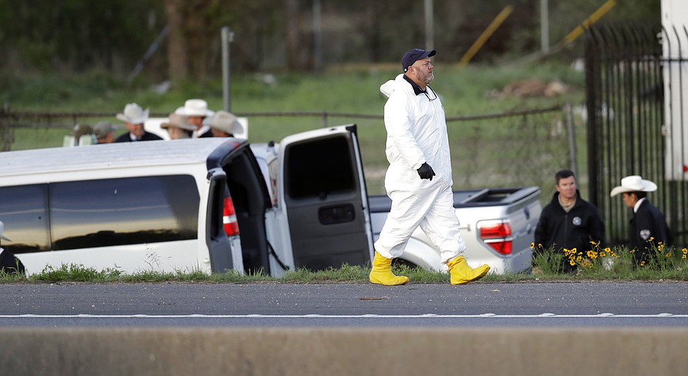 Officials investigate the scene where a suspect in a series of bombing attacks in Austin blew himself up as authorities closed in, Wednesday, March 21, 2018, in Round Rock, Texas. (AP Photo/Eric Gay)