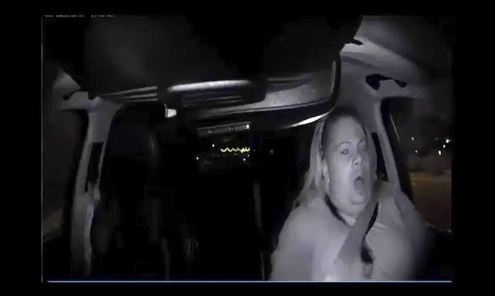 Video image showing an interior view moments before an Uber SUV hit a woman in Tempe, Arizona on Sunday, March 18, 2018. The video shows a human backup driver in the SUV looking down until seconds before the crash. The driver looked up and appeared startled during the last moment of the clip. (Tempe Police Department)