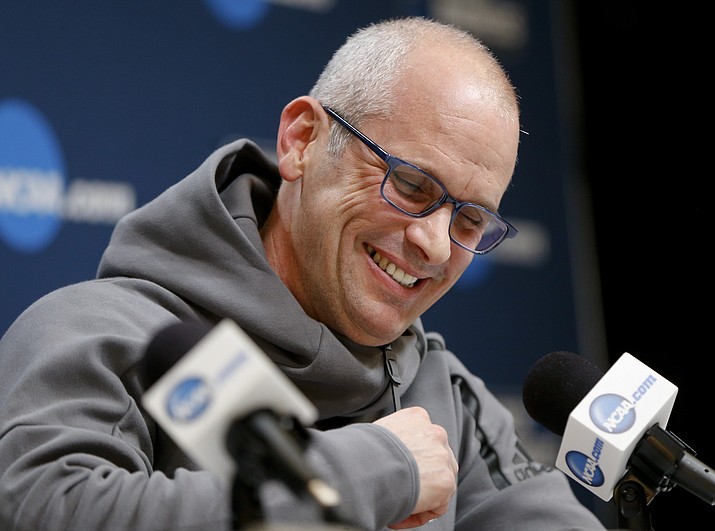 In this March 14, 2018, file photo, Rhode Island's head coach Dan Hurley takes questions during a news conference for an NCAA college basketball first round game in Pittsburgh. Rhode Island head basketball coach Dan Hurley has agreed to become the head coach at the University of Connecticut. Hurley replaces Kevin Ollie, who was fired earlier this month. UConn made the announcement Thursday, March 22, 2018, in a Tweet. (Keith Srakocic/AP, File)