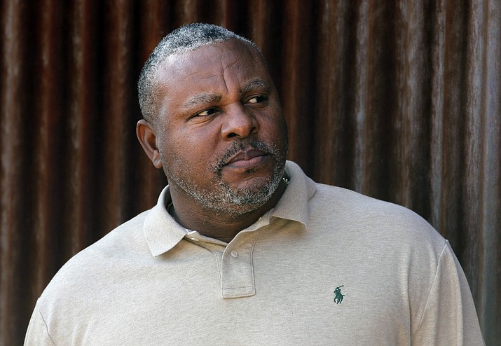 In this Tuesday, Feb. 28, 2012, file photo, former baseball player Albert Belle looks on as he visits the Cleveland Indians' spring training camp in Goodyear, Ariz. Belle has been arrested on indecent exposure and extreme driving under the influence charges following a spring training game in Arizona. Belle was taken into custody in Scottsdale, Arizona, on Sunday, March 25, 2018. (Jae C. Hong/AP, File)