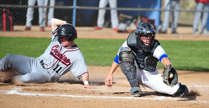 Prescott catcher Chase Kasun gets the ball too late to tag a runner scoring as the Badgers hosted Coconino on Tuesday, March 27, 2018, in Prescott. (Les Stukenberg/Courier)