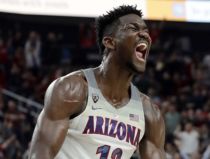 In this March 10, 2018, file photo, Arizona's Deandre Ayton reacts after a dunk against Southern California during the second half for the Pac-12 men's tournament championship in Las Vegas. Ayton is a member of the Associated Press NCAA college basketball All-America first team, announced Tuesday, March 27, 2018. (Isaac Brekken/AP, File)