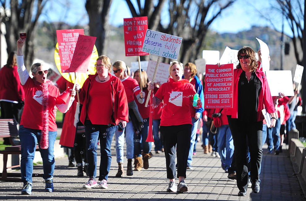 Hundreds of local teachers, students, family members and supporters march around the Yavapai County Courthouse Plaza Wednesday, March 28, 2018, as they seek more competitive pay and better benefits for educators in Yavapai County and Arizona. (Les Stukenberg/Courier)