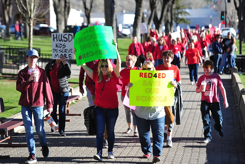 Hundreds of local teachers, students, family members and supporters march around the Yavapai County Courthouse Plaza Wednesday, March 28, 2018 as they seek more competitive pay and better benefits for educators in Yavapai County and Arizona. (Les Stukenberg/Courier)
