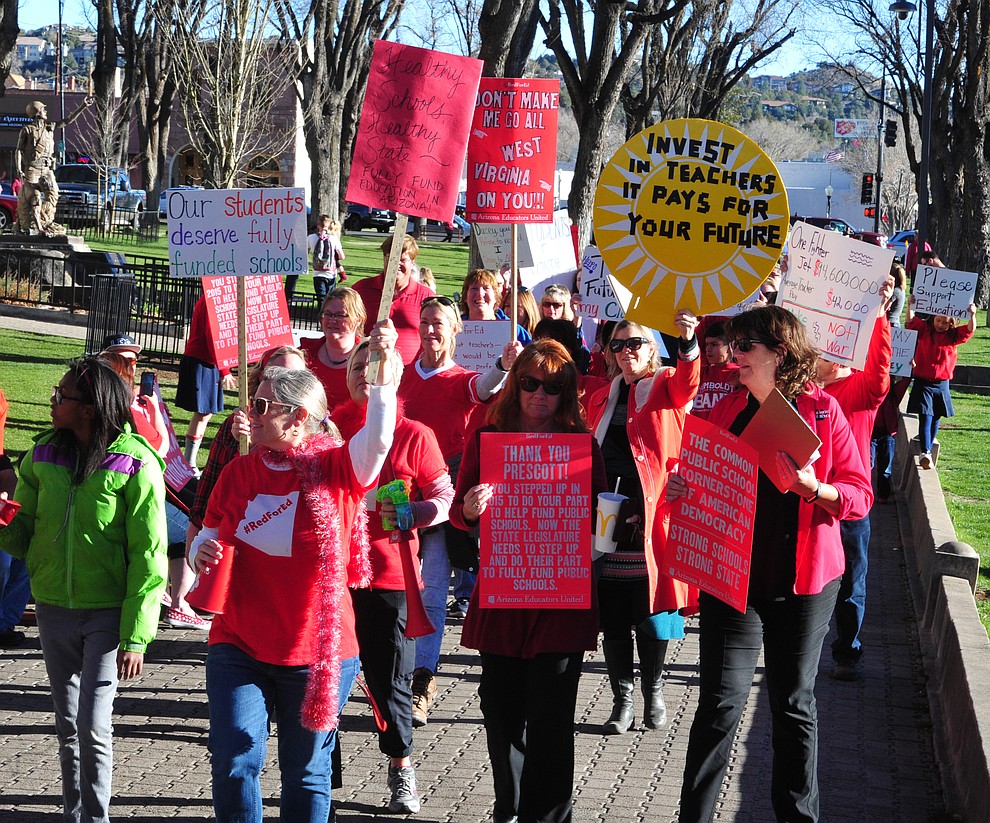 Hundreds of local teachers, students, family members and supporters march around the Yavapai County Courthouse Plaza Wednesday, March 28, 2018 as they seek more competitive pay and better benefits for educators in Yavapai County and Arizona. (Les Stukenberg/Courier)