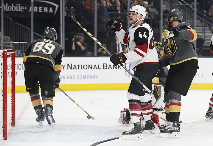 Arizona Coyotes defenseman Kevin Connauton celebrates after scoring against the Vegas Golden Knights during the first period of an NHL hockey game, Wednesday, March 28, 2018, in Las Vegas. (AP Photo/John Locher)