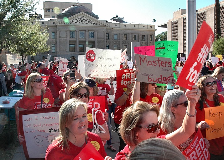 Teachers rally Wednesday at the state Capitol seeking higher pay. (Capitol Media Services photo by Howard Fischer)
