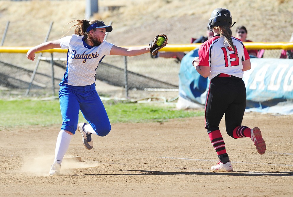 Prescott's Margaret Boelts gets the tag at first base as the Badgers host Coconino in softball Thursday, March 29, 2018. (Les Stukenberg/Courier)