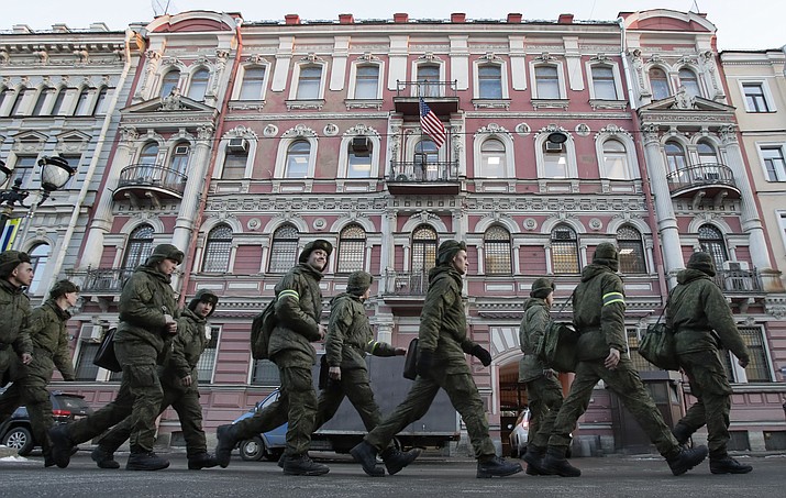 Military cadets walk past the U.S. consulate in St.Petersburg, Russia, Saturday, March 31, 2018. Russia announced the expulsion of more than 150 diplomats, including 60 Americans, on Thursday and said it was closing a U.S. consulate in retaliation for the wave of Western expulsions of Russian diplomats over the poisoning of an ex-spy and his daughter in Britain, a tit-for-tat response that intensified the Kremlin's rupture with the United States and Europe. (AP Photo/Dmitri Lovetsky)

