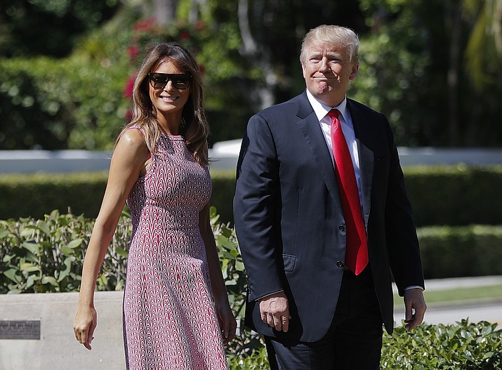 President Donald Trump and first lady Melania Trump arrive for Easter services at Episcopal Church of Bethesda-by-the-Sea, in Palm Beach, Fla., Sunday, April 1, 2018. (AP Photo/Pablo Martinez Monsivais)

