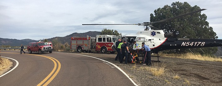 A man in his 30s is loaded into a Native Air helicopter, which transported him to a Phoenix hospital after he lost control of his motorcycle and crashed Saturday, March 31, on White Spar Road in Prescott. (PFD/Courtesy)