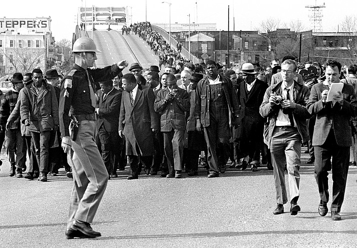 In this March 10, 1965, file photo, demonstrators, including Dr. Martin Luther King, Jr., stream over an Alabama River bridge at the city limits of Selma, Ala., during a voter-rights march. King was fatally shot April 4, 1968, in Memphis, Tenn. Wednesday -- April 4, 2018 -- marks the 50th anniversary of his assassination. (AP Photo,File)