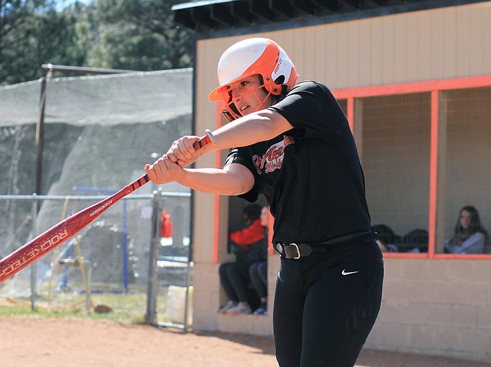 Jazlyn Romero takes a practice swing March 27 during a game with Mogollon.