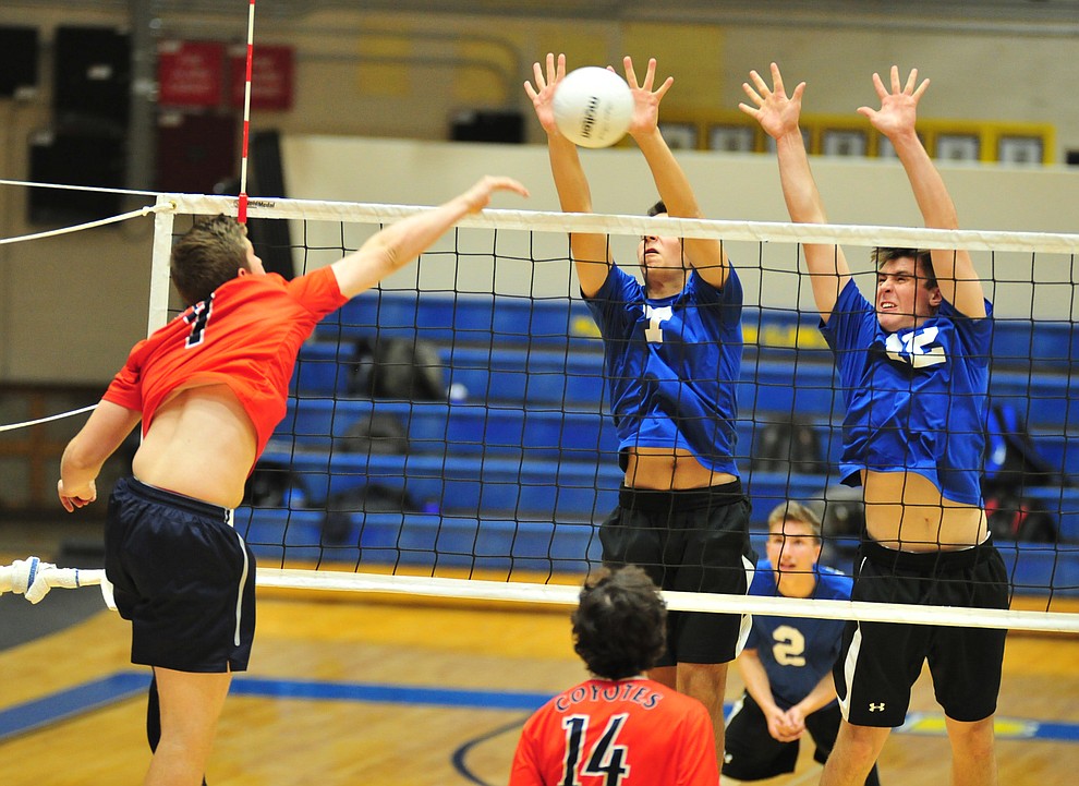 Prescott's Spencer Davis and Paul Kinach go for a block as the Badgers hosted Centennial High School in a volleyball matchup Tuesday, April 3, 2018. (Les Stukenberg/Courier)