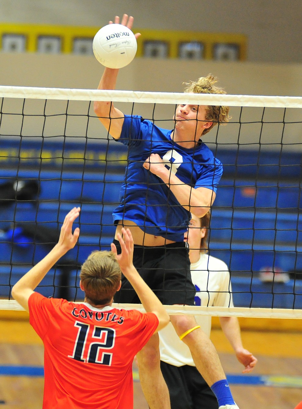 Prescott's Dallin Jex hits a kill as the Badgers hosted Centennial High School in a volleyball matchup Tuesday, April 3, 2018. (Les Stukenberg/Courier)