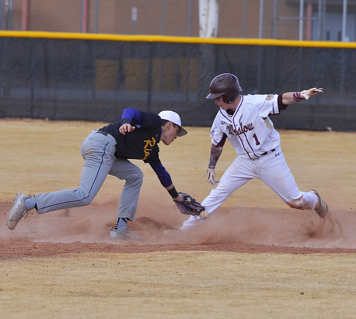 The Winslow boys and girls baseball and softball teams play against Blue Ridge March 26. The boys won 5-0 and the girls won 12-6. Brennan Sawyer steals second base. (Todd Roth/NHO)
