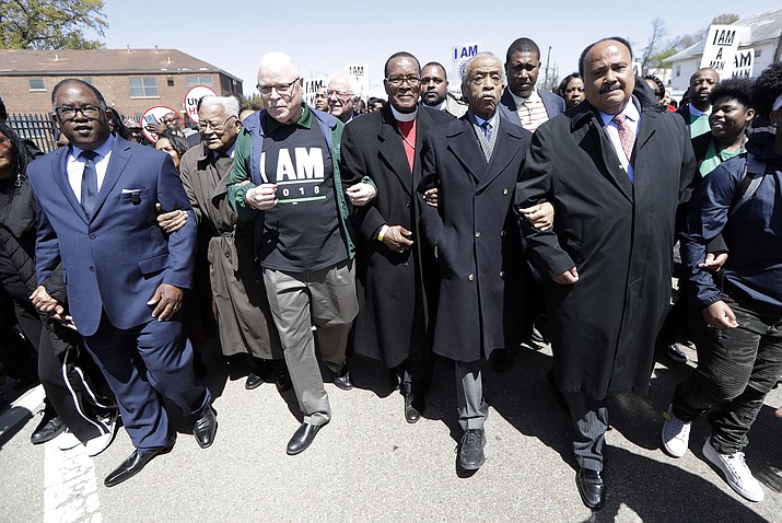 Martin Luther King III, right, and Rev. Al Sharpton, second from right, join in a march commemorating the anniversary of the assassination of Rev. Martin Luther King Jr. Wednesday, April 4, 2018, in Memphis, Tenn. Martin Luther King Jr. was assassinated April 4, 1968, while in Memphis supporting striking sanitation workers. (AP Photo/Mark Humphrey)


