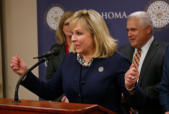 In this March 28, 2018 file photo, Oklahoma Gov. Mary Fallin speaks during a news conference following a vote on a package of tax hikes to fund teacher pay raises in Oklahoma City. Fallin says public school teachers who are striking for more classroom funding are like "a teenage kid that wants a better car." In an interview with CBS News, Tuesday, April 3, 2018. Fallin signed legislation last week increasing teacher pay but teachers have been on strike for more. (AP Photo/Sue Ogrocki File)

