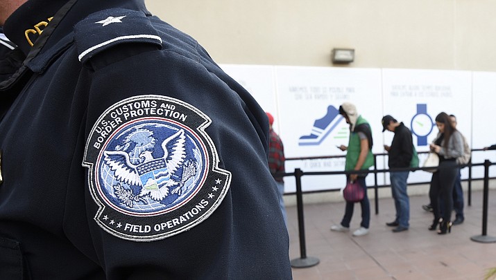 File photo showing a U.S. Customs and Border Protection officer. (AP Photo/Denis Poroy, File)
