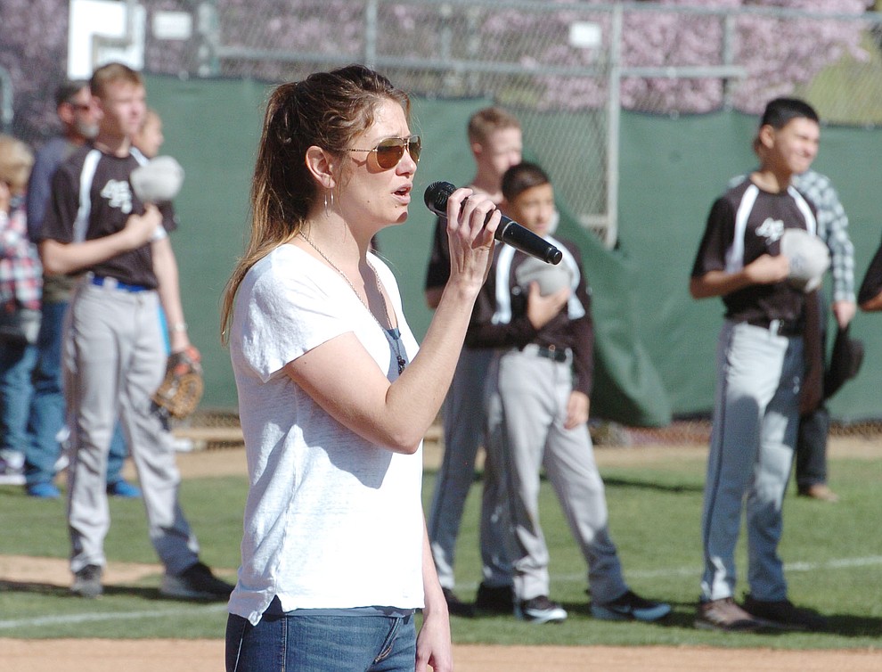 Joanne Golleher sings the National Anthem during opening ceremonies for the 2018 Prescott Little League Saturday, April 7, 2018 at Bill Vallely Field in Prescott. (Les Stukenberg/Courier)