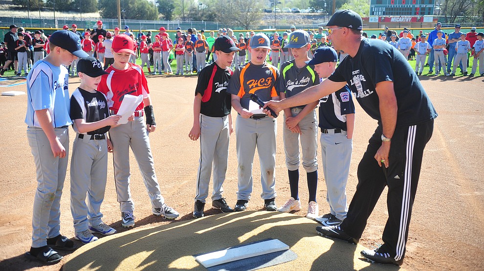 Players from each of the mjors teams recite the Little League Pledge during opening ceremonies for the 2018 Prescott Little League Saturday, April 7, 2018 at Bill Vallely Field in Prescott. (Les Stukenberg/Courier)