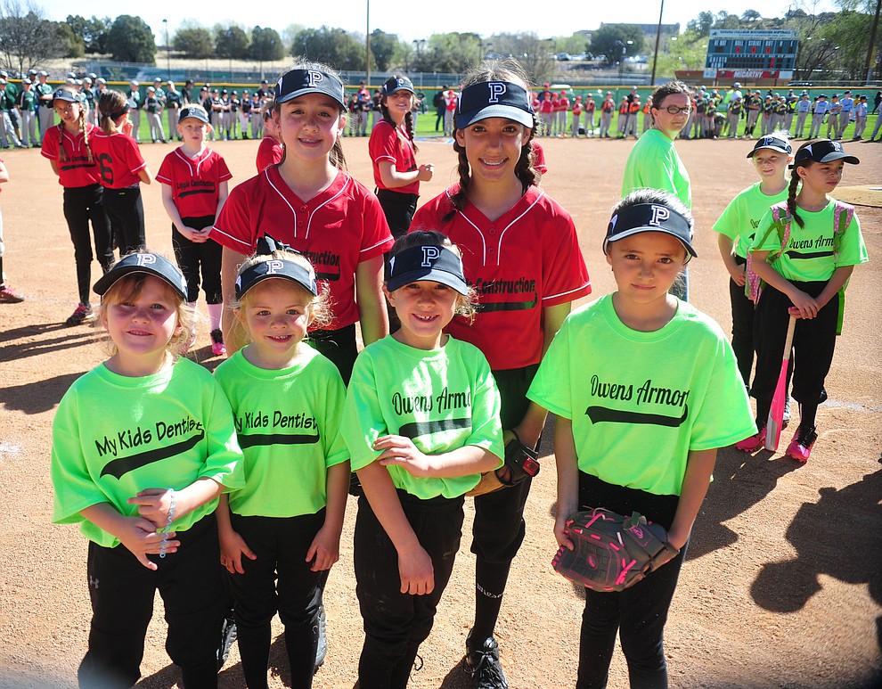 Prescott Little League will now have a softball division with three teams representing them are, front row from left Morgan Cook, Jasey Laipple, Taylor Howell and Jocelyn Schepman, back rown Jaycee Hanna and Laney Lucas, during opening ceremonies for the 2018 Prescott Little League Saturday, April 7, 2018 at Bill Vallely Field in Prescott. (Les Stukenberg/Courier)