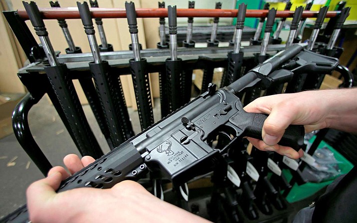 Pictured is a newly assembled AR-15 rifle at the Stag Arms company in New Britain, Conn. Assault weapons and large-capacity magazines are not protected by the Second Amendment, a federal judge said in a ruling released Friday, April 6, 2018 by a federal judge in Boston, upholding Massachusetts' ban on the weapons. (Charles Krupa, AP file)