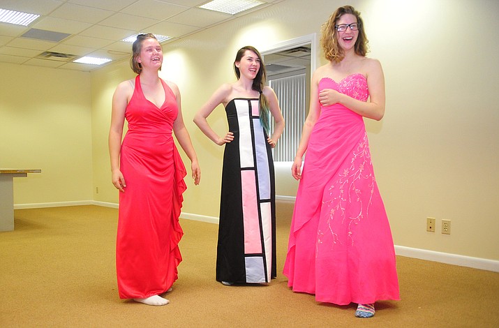 From left, Hannah McGee, Faith Greer and April Burton each found their perfect dress at the Priceless Prom shop in Prescott Thursday, April 5, 2018. The store is located in donated space on the third floor in the Bulleri Building, 122 North Cortez St. The shop’s next open dates are 3:30 to 5:30 p.m. Tuesday, April 10, Monday, April 16, and Friday, April 20. (Les Stukenberg/Courier)
