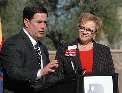 The questions in SB 1394, approved on a 35-22 margin, are not quite as intrusive as had originally been proposed by Cathi Herrod, here with Gov. Doug Ducey, and her anti-abortion Center for Arizona Policy. 