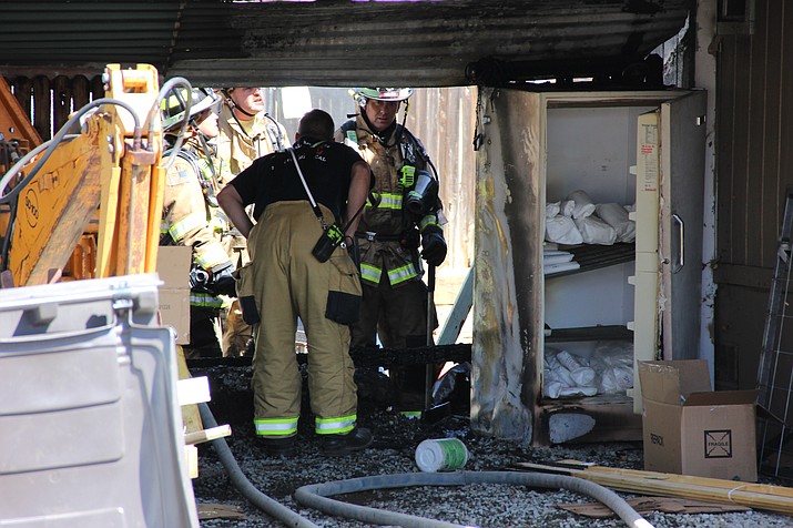 Personnel with the Central Arizona Fire and Medical Authority evaluate the origin of a home fire in the 5000 block of North Pinon Drive in Prescott Valley. The fire started in the area of a freezer, said Central Arizona Fire and Medical Authority Battalion Chief Todd Abel. 