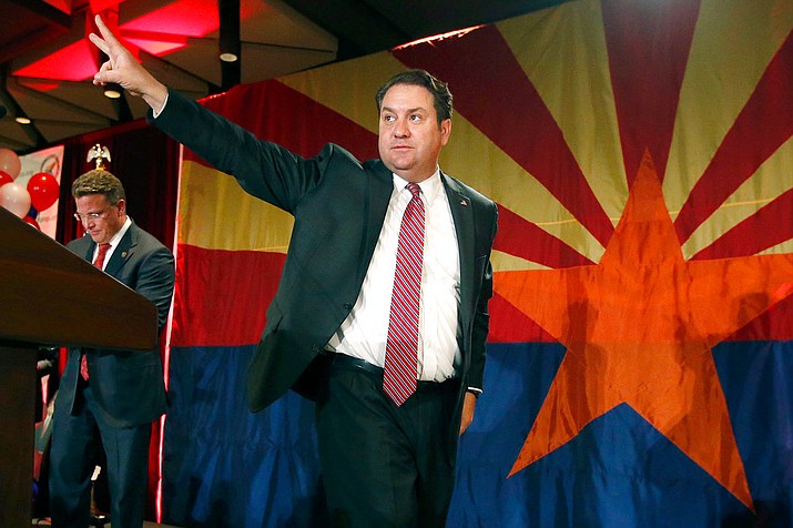 In this Nov. 4, 2014 file photo, Arizona Republican Attorney General Mark Brnovich waves to supporters at the Republican election night party in Phoenix. Minority Democrats in the Arizona Legislature have urged Brnovich to join the lawsuit challenging the citizenship question in the 2020 census. But his spokesman said that won’t happen, just as he refused to sign onto the Republican letter urging the question be included in the census. “We have concerns this issue has been overly politicized,” Brnovich spokesman Ryan Anderson said in a statement. (AP Photo/Ross D. Franklin, File)