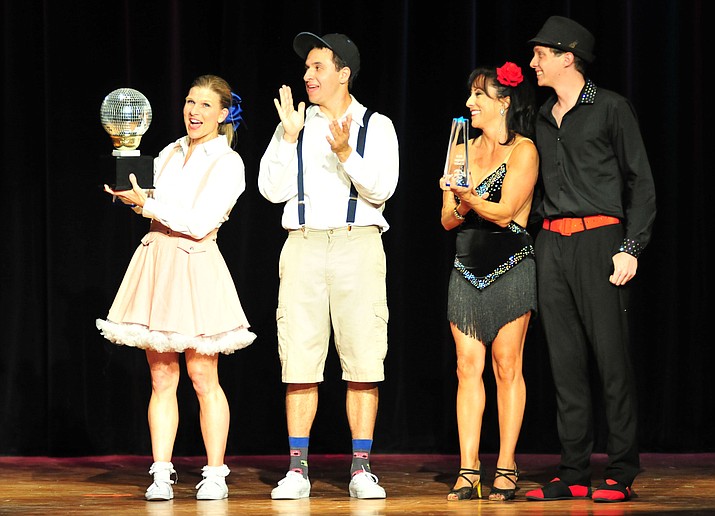 From left, Michelle Fain and Leo Gallegos raised the most money and got the most fan votes while Elena Sanwick and Daniel Garcia, at right, won the judges’ votes at the Dancing for the Stars event Saturday, April 14, 2018, in Prescott. (Les Stukenberg/Courier)