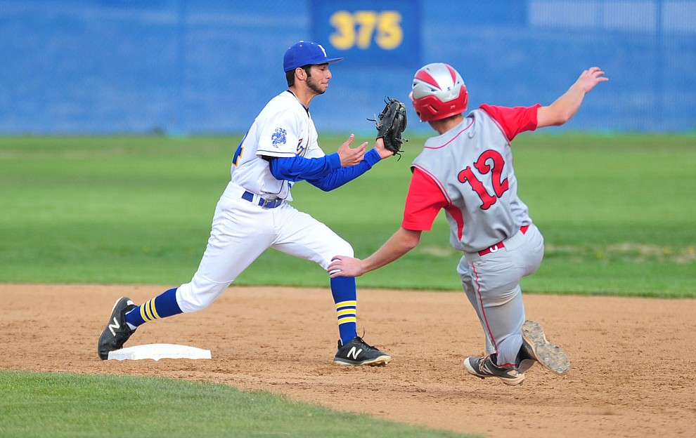 Prescott's Jacob Police starts to turn a double play as the Badgers face the Mingus Marauders Monday, April 16, 2018 in Prescott. (Les Stukenberg/Courier)