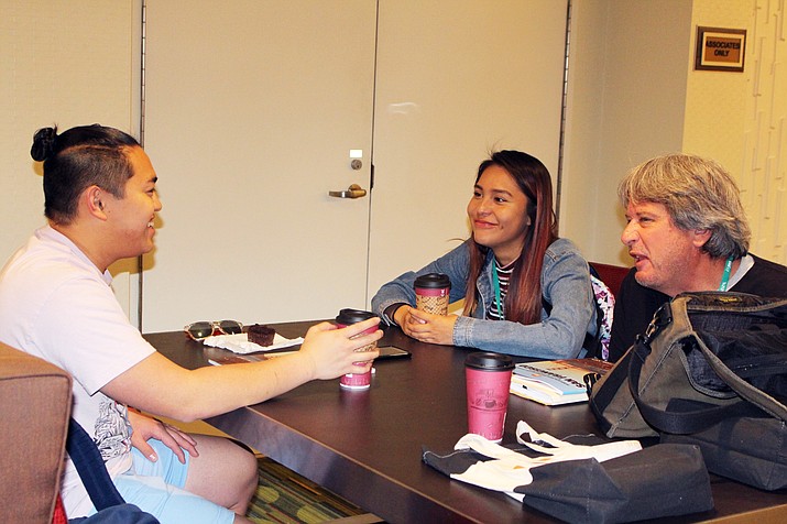 Former Journalism Education Association President Mark Newton chats with Hopi High journalism students Sean Bolus and Ellyse Fredericks. (Stan Bindell/NHO)