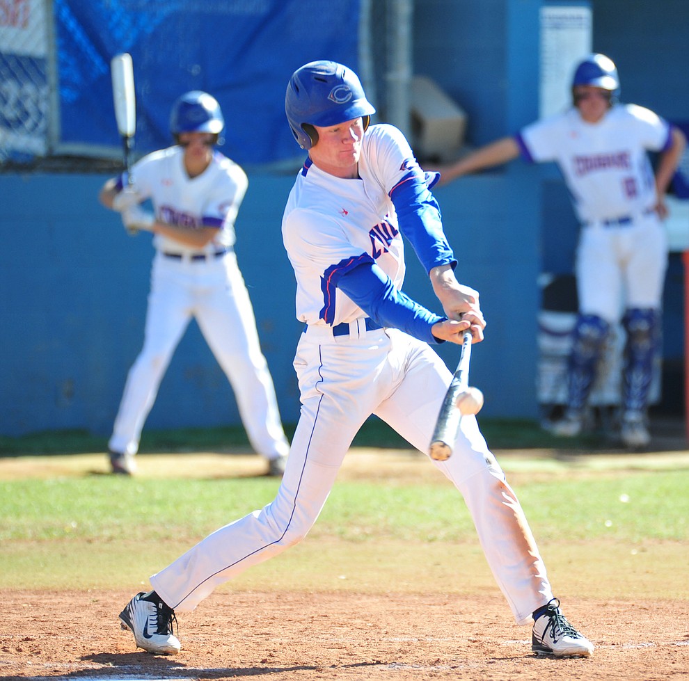 Chino Valley's Colton Sandberg makes contact for a single as the Cougars host the Kingman Bulldogs in baseball Tuesday, April 17, 2018 in Chino Valley. (Les Stukenberg/Courier)