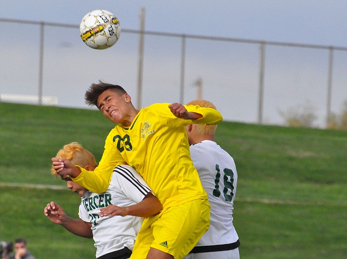 Yavapai College midfielder John Scearce (23) goes up for a header against Mercer County College during the NJCAA Men’s Soccer National Tournament on Nov. 15, 2017, in Prescott Valley. Scearce was named Yavapai College’s Student-Athlete of the Year on Wednesday, April 18, 2018. (YC Athletics/Courtesy)
